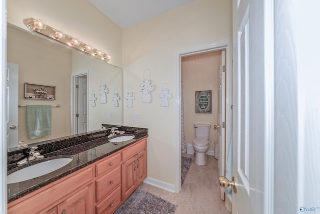 bathroom with vanity and toilet