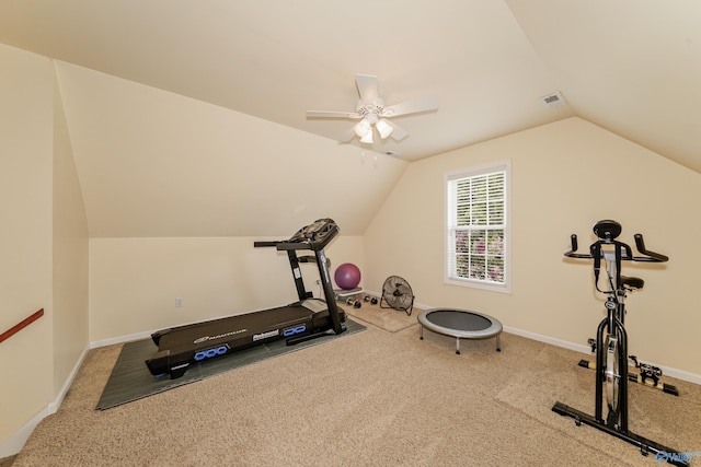 exercise room with lofted ceiling, ceiling fan, and carpet floors