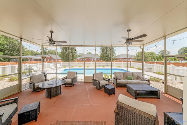 sunroom with ceiling fan and plenty of natural light