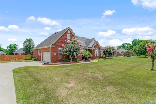 view of front of property featuring a garage and a front lawn