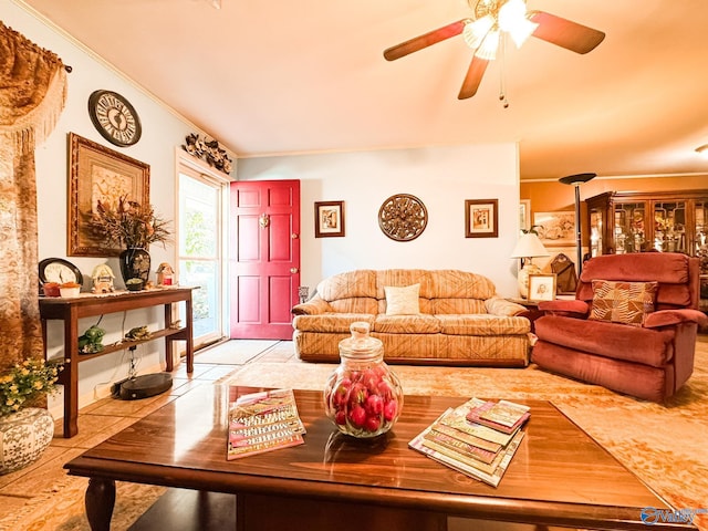 tiled living room featuring ornamental molding and ceiling fan