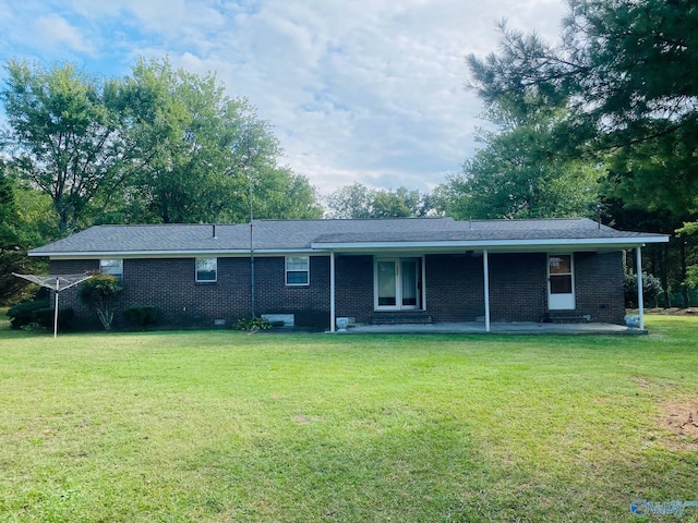 back of house with a yard