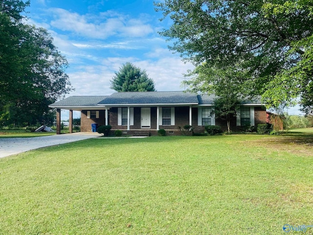 ranch-style home with a front lawn, a carport, and covered porch