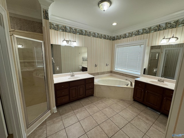 bathroom with tile patterned floors, crown molding, vanity, and independent shower and bath