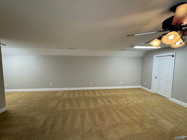 basement with ceiling fan and carpet flooring