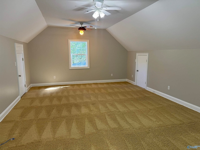 bonus room featuring lofted ceiling, ceiling fan, and light carpet