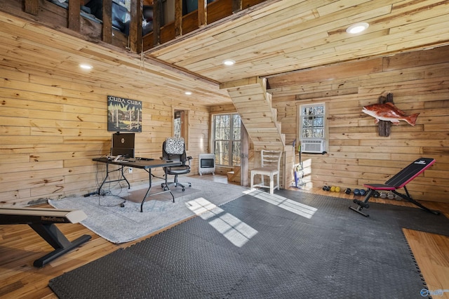 unfurnished office featuring carpet, cooling unit, and wood walls