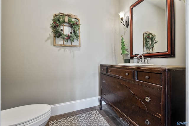 bathroom with tile patterned floors, vanity, and toilet