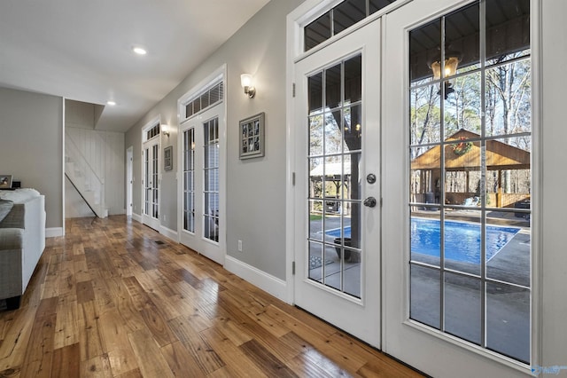 entryway featuring french doors and wood-type flooring