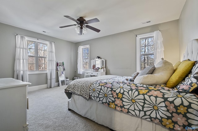 bedroom with light colored carpet and ceiling fan