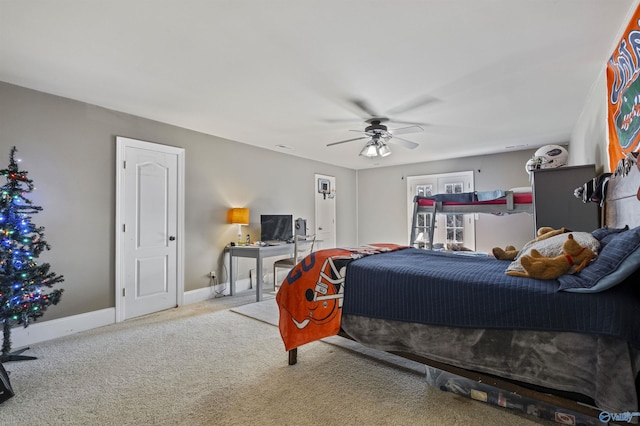 bedroom featuring ceiling fan and light colored carpet