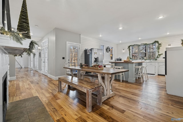 dining area with light hardwood / wood-style floors