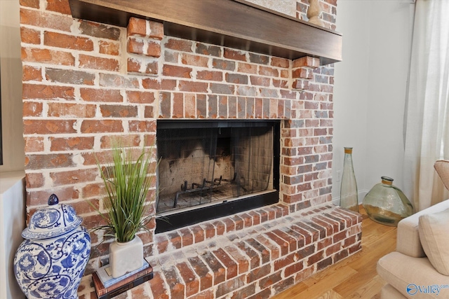 22424 Cantera Dr, Athens, AL 35613 - detailed view of wood finished floors and a fireplace