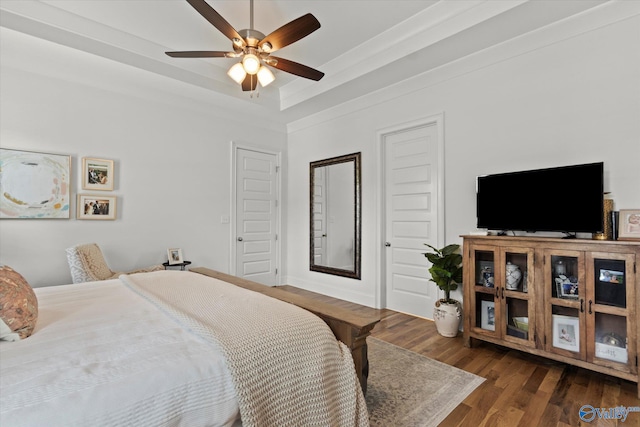 22424 Cantera Dr, Athens, AL 35613 - bedroom featuring wood finished floors, a raised ceiling, and ceiling fan