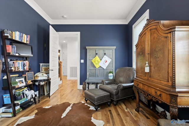 22424 Cantera Dr, Athens, AL 35613 - living area with wood finished floors and ornamental molding