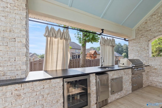 22424 Cantera Dr, Athens, AL 35613 - view of patio with wine cooler, grilling area, exterior kitchen, and fence