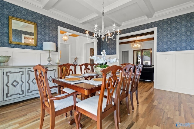 22424 Cantera Dr, Athens, AL 35613 - dining space with a chandelier, wallpapered walls, wood finished floors, beam ceiling, and coffered ceiling