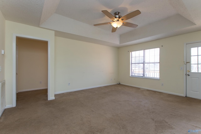 143 Laredo Cir, Huntsville, AL 35811 - carpeted empty room with a raised ceiling, a ceiling fan, baseboards, and a textured ceiling