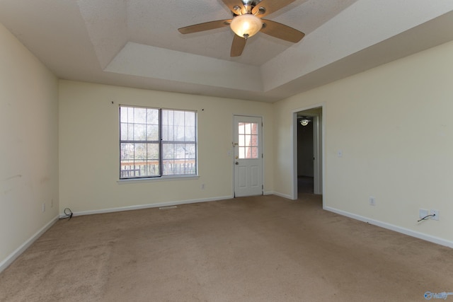 143 Laredo Cir, Huntsville, AL 35811 - unfurnished room with a raised ceiling, carpet floors, baseboards, and a ceiling fan