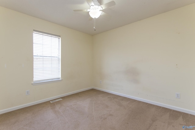 143 Laredo Cir, Huntsville, AL 35811 - spare room with baseboards, light colored carpet, and a ceiling fan