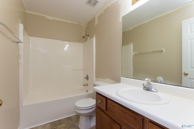 143 Laredo Cir, Huntsville, AL 35811 - bathroom with toilet, vanity, a textured ceiling, and bathing tub / shower combination