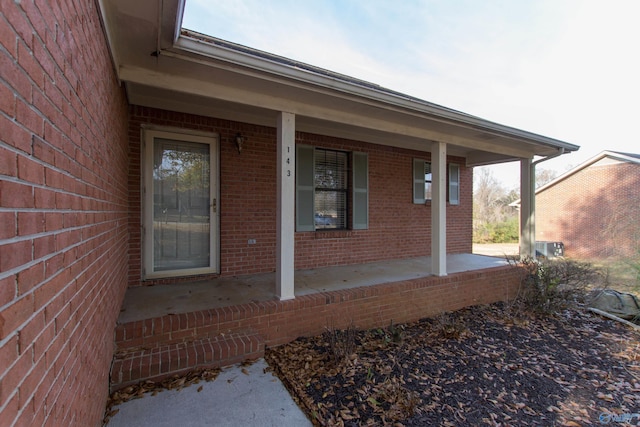 143 Laredo Cir, Huntsville, AL 35811 - view of exterior entry with a porch and brick siding