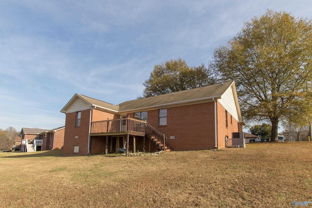 143 Laredo Cir, Huntsville, AL 35811 - rear view of property with brick siding, a wooden deck, a yard, and stairway
