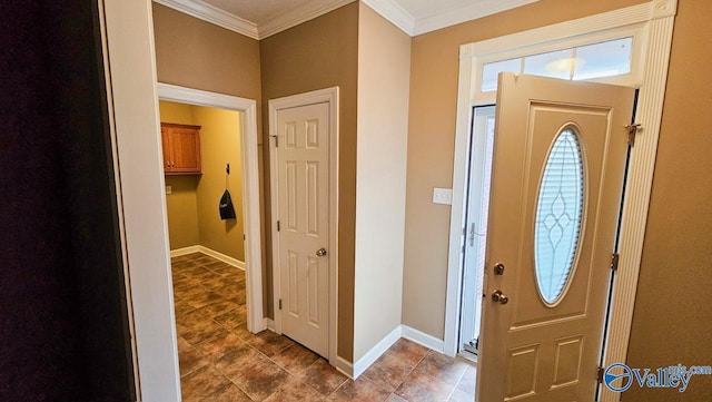 foyer featuring baseboards and ornamental molding