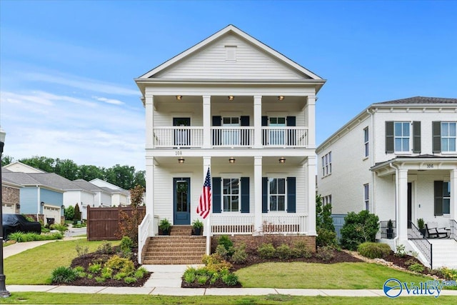 108 Napolean Ave, Madison, AL 35758 - greek revival house featuring a balcony, covered porch, stairs, and a front lawn