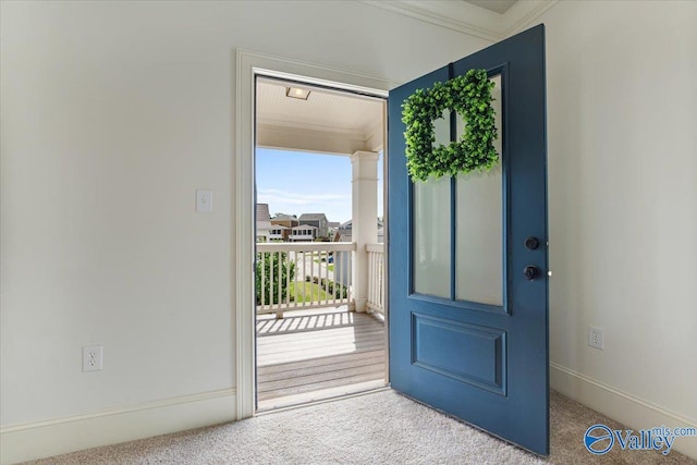 108 Napolean Ave, Madison, AL 35758 - doorway to outside with carpet floors, crown molding, and baseboards