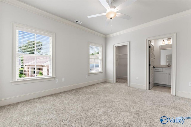 108 Napolean Ave, Madison, AL 35758 - unfurnished bedroom with light colored carpet, ornamental molding, baseboards, a spacious closet, and ensuite bathroom