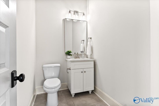 108 Napolean Ave, Madison, AL 35758 - bathroom with tile patterned floors, toilet, vanity, and baseboards