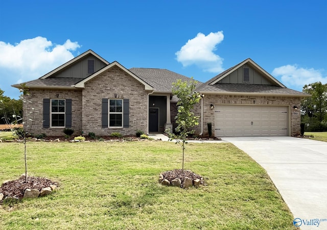 view of front facade with a garage and a front yard