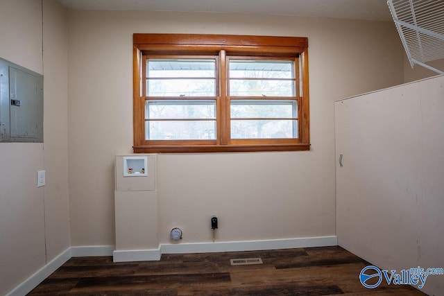 clothes washing area featuring electric panel, hookup for a washing machine, and dark wood-type flooring