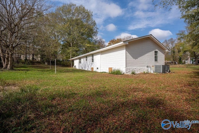 view of property exterior featuring a yard and central air condition unit