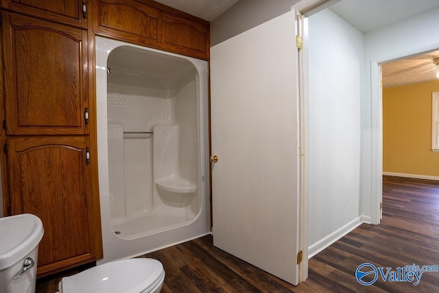 bathroom with a shower and hardwood / wood-style flooring