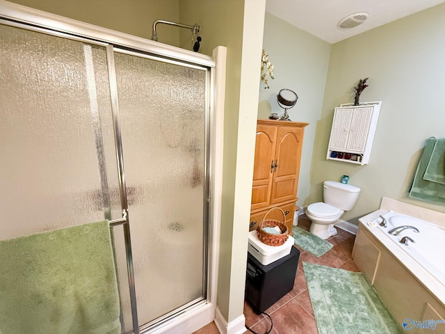 bathroom featuring toilet, a shower stall, a bath, and tile patterned floors