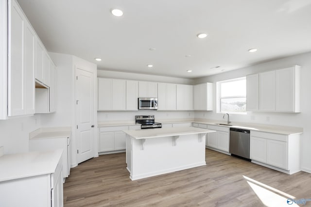 139 Jude Ln, Hazel Green, AL 35750 - kitchen featuring stainless steel appliances, a sink, a kitchen island, white cabinetry, and recessed lighting