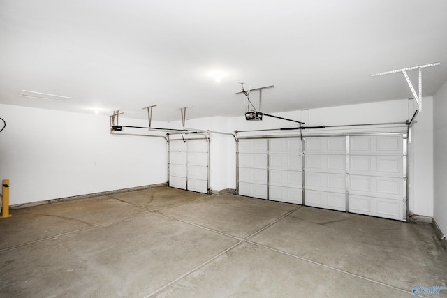 139 Jude Ln, Hazel Green, AL 35750 - garage featuring a garage door opener and baseboards