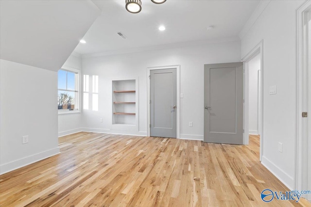 unfurnished bedroom featuring recessed lighting, visible vents, light wood-style floors, ornamental molding, and baseboards