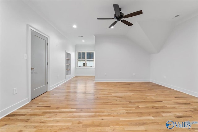 interior space with light wood-type flooring, baseboards, a ceiling fan, and recessed lighting