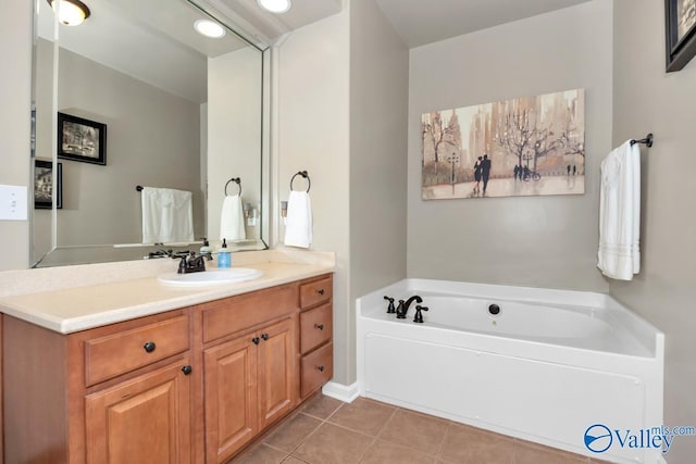 full bathroom with vanity, a bath, and tile patterned floors