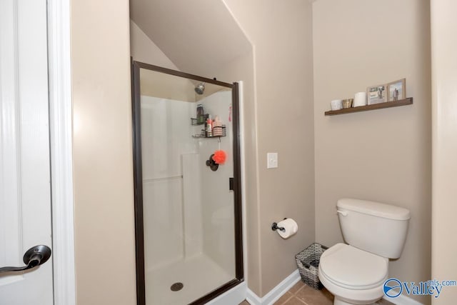 full bathroom with baseboards, a stall shower, toilet, and tile patterned floors