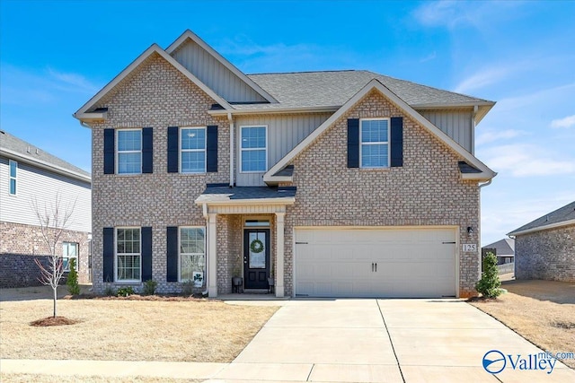 view of front of home featuring an attached garage, board and batten siding, driveway, and roof with shingles