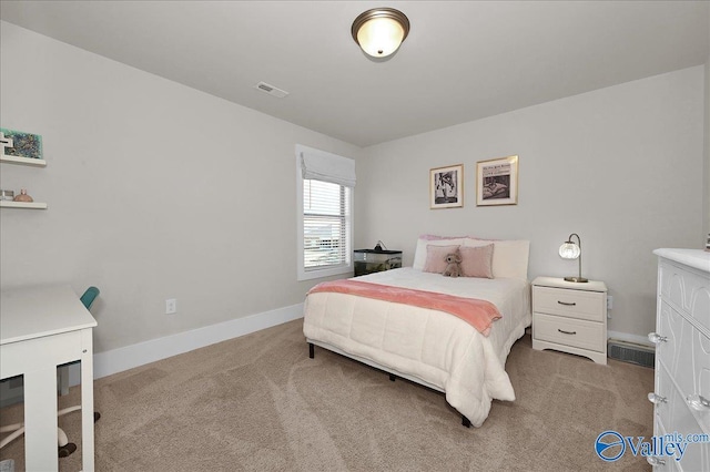 bedroom featuring visible vents, light carpet, and baseboards