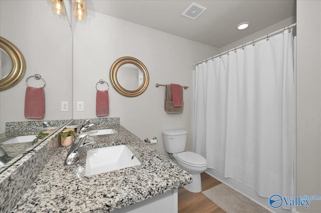 full bathroom featuring a sink, visible vents, and toilet