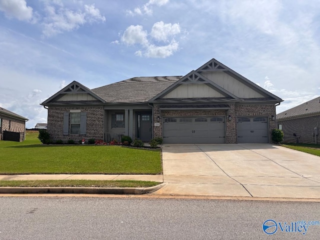 404 Peach Orchard Ln, Madison, AL 35757 - craftsman-style house with brick siding, a garage, a front yard, and driveway