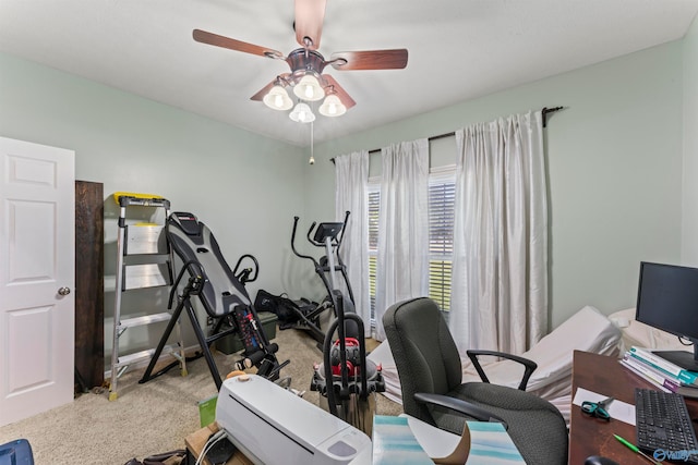 exercise room with carpet flooring and ceiling fan