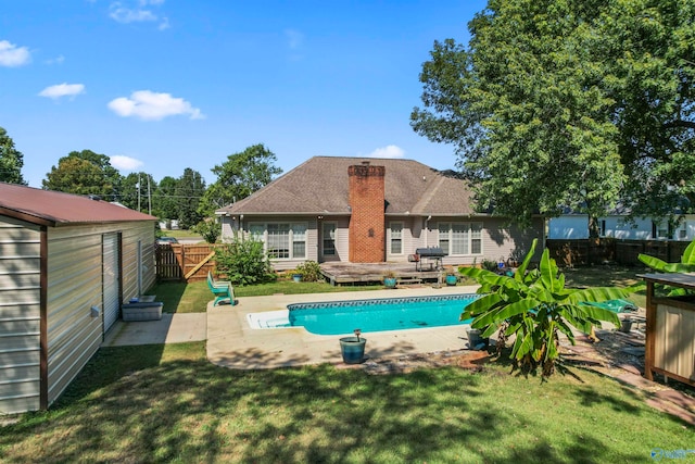 view of pool featuring a patio and a lawn