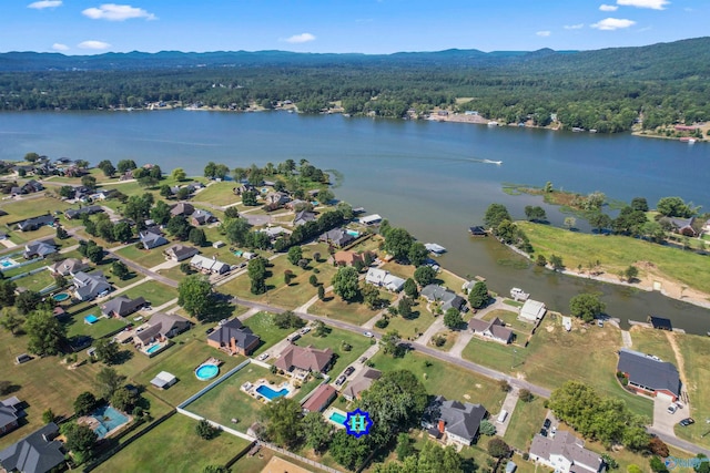 birds eye view of property featuring a water and mountain view